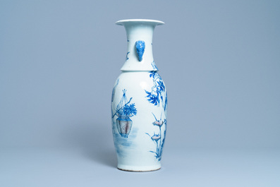 A Chinese blue, white and copper red vase with elephant handles, 19th C.
