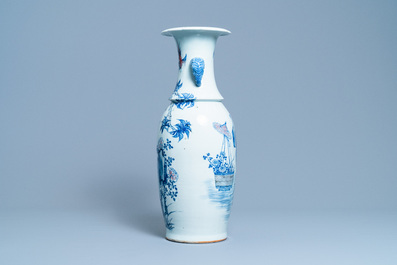 A Chinese blue, white and copper red vase with elephant handles, 19th C.