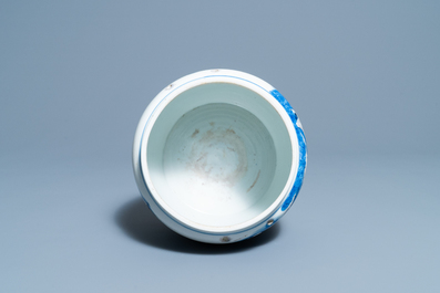 A Chinese blue, white and copper red 'prunus flowers' bowl, Kangxi