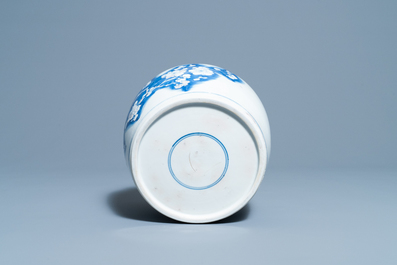 A Chinese blue, white and copper red 'prunus flowers' bowl, Kangxi