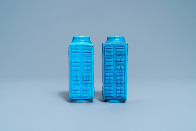 A pair of Chinese monochrome turquoise 'cong' vases with trigrams, 19th C.