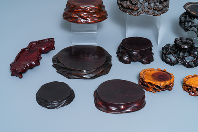 Twelve Chinese carved wooden stands, 19/20th C.