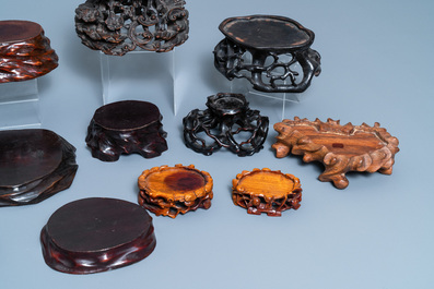 Twelve Chinese carved wooden stands, 19/20th C.