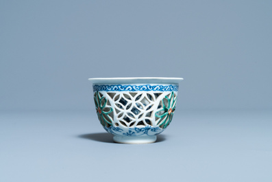 A rare Chinese famille verte reticulated double-walled cup, Kangxi