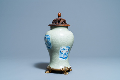 Een Chinese celadon vaas met blauw-witte en koperrode panelen, Kangxi