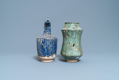 A turquoise-glazed Islamic pottery albarello and a blue-glazed ewer, Iran or Syria, 12/13th C.