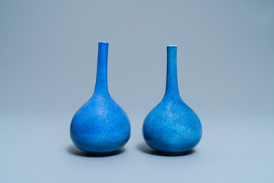 A pair of Chinese monochrome powder blue bottle vases, Kangxi