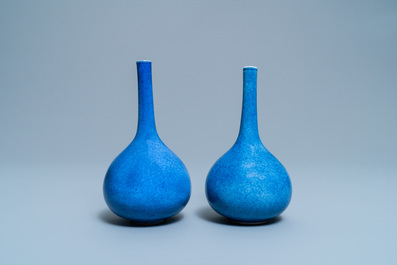 A pair of Chinese monochrome powder blue bottle vases, Kangxi