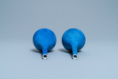 A pair of Chinese monochrome powder blue bottle vases, Kangxi