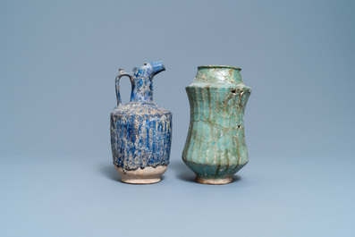 A turquoise-glazed Islamic pottery albarello and a blue-glazed ewer, Iran or Syria, 12/13th C.
