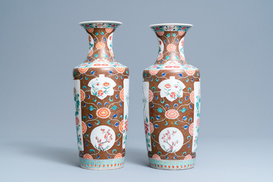 A pair of Chinese famille rose rouleau vases, 19th C.