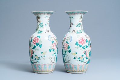 A pair of Chinese famille rose 'phoenix' vases, 19th C.