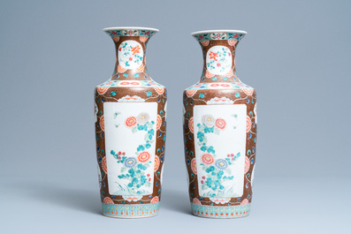 A pair of Chinese famille rose rouleau vases, 19th C.