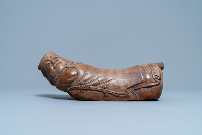 A Chinese bamboo 'recumbent boy' pillow, 19th C.