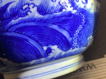 A Chinese blue and white 'dragon and carps' bowl, Xuande mark, Kangxi