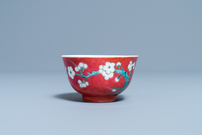 A Chinese famille rose ruby-ground cup and saucer, Yongzheng