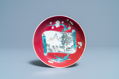 A Chinese famille rose ruby-ground cup and saucer, Yongzheng