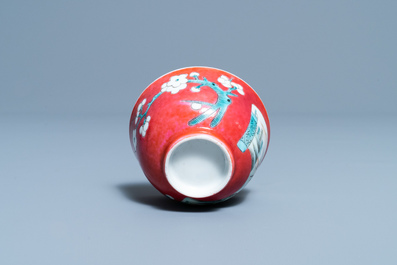 A Chinese famille rose ruby-ground cup and saucer, Yongzheng