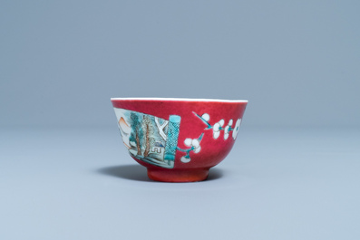 A Chinese famille rose ruby-ground cup and saucer, Yongzheng