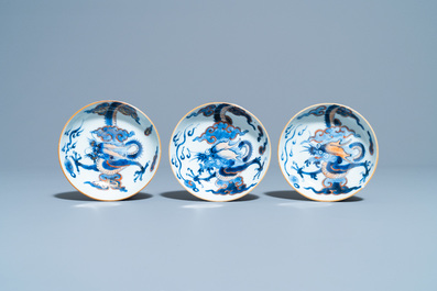 Six Chinese doucai 'dragon' cups and saucers, Kangxi