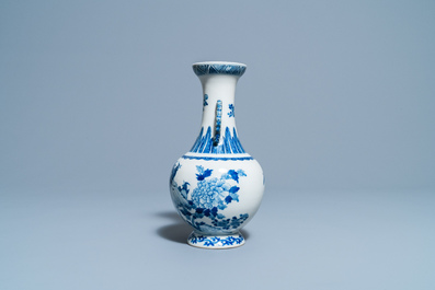 A Chinese blue and white vase with a bird among blossoms, Qianlong mark, 19th C.
