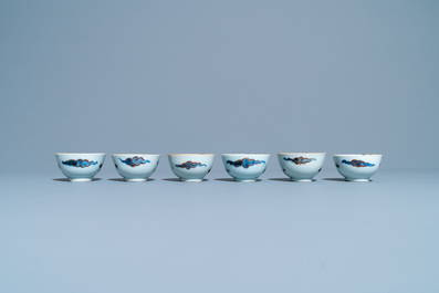 Six Chinese doucai 'dragon' cups and saucers, Kangxi