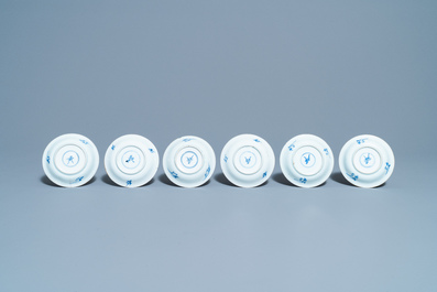 Six Chinese blue, white and copper red cups and saucers, Kangxi
