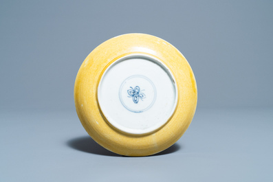 A Chinese sancai-glazed plate with carved floral design, Kangxi