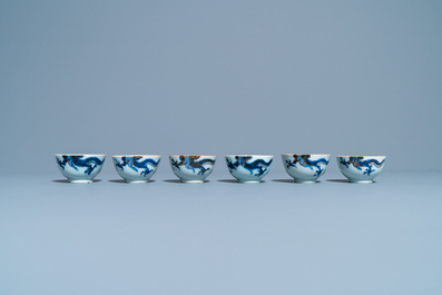 Six Chinese doucai 'dragon' cups and saucers, Kangxi