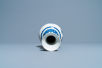 A Chinese blue and white vase with a bird among blossoms, Qianlong mark, 19th C.