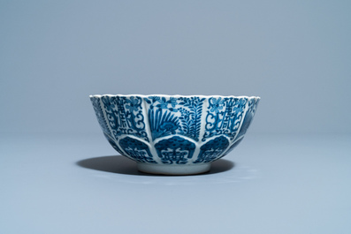 A Chinese blue and white lotus-molded bowl, Jiajing mark, 19th C.