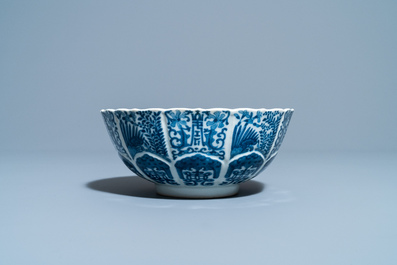 A Chinese blue and white lotus-molded bowl, Jiajing mark, 19th C.
