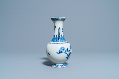 A Chinese blue and white vase with a bird among blossoms, Qianlong mark, 19th C.