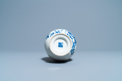 A Chinese blue and white vase with a bird among blossoms, Qianlong mark, 19th C.