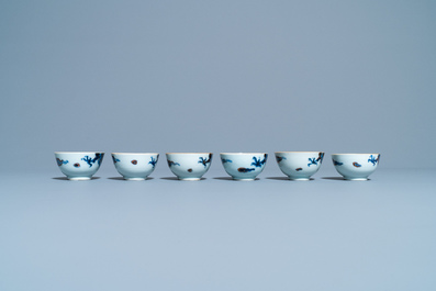 Six Chinese doucai 'dragon' cups and saucers, Kangxi