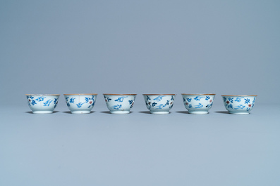 Six Chinese blue, white and copper red cups and saucers, Kangxi
