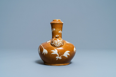 A rare Chinese slip-decorated brown-ground Swatow kendi, Ming