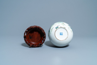 A Chinese famille rose bottle vase with quails, Qianlong mark, 19th C.