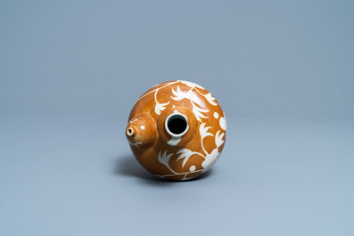 A rare Chinese slip-decorated brown-ground Swatow kendi, Ming