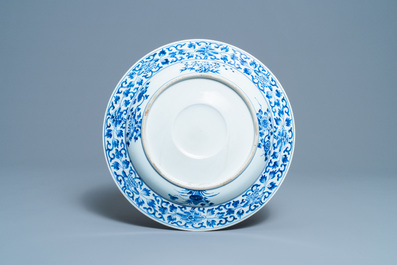 A Chinese blue and white dish with raised central medallion, Kangxi