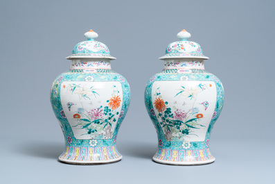 A pair of Chinese famille rose vases and covers, 19th C.