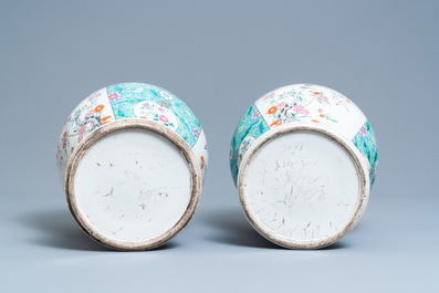 A pair of Chinese famille rose vases and covers, 19th C.