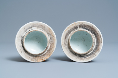A pair of Chinese famille rose vases and covers, 19th C.