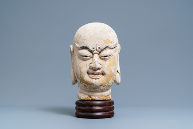 A Chinese painted sandstone head of a luohan, Ming