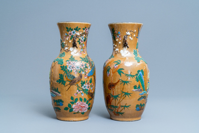 A pair of Chinese famille rose relief-molded vases and two with phoenixes, 19th C.