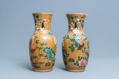 A pair of Chinese famille rose relief-molded vases and two with phoenixes, 19th C.
