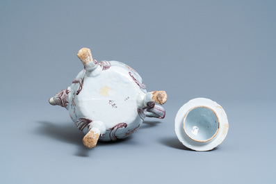 A tall polychrome Dutch Delft coffee pot and cover, 18th C.