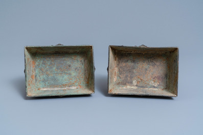 A pair of Chinese Ming-style bronze censers with reticulated covers, 19th C.