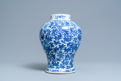 A Chinese blue and white 'lotus scroll' vase, 19th C.
