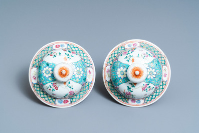 A pair of Chinese famille rose vases and covers, 19th C.